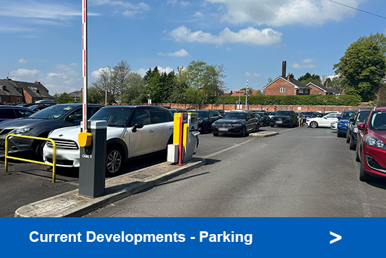 Photo of cars in a car park linking to car parking development information